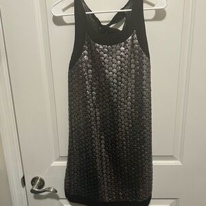 Silver sequin and black dress with bow tie detailing in the back.